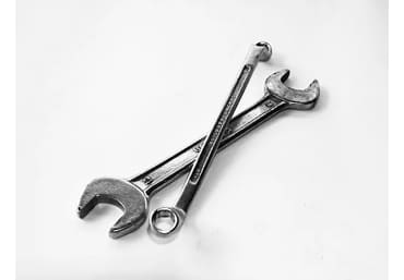 Electrician using a power drill on-site